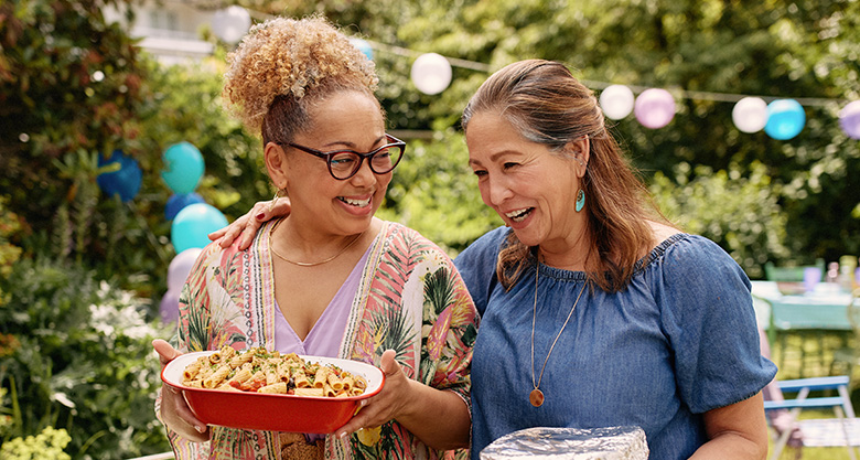 Two women at an outdoor party